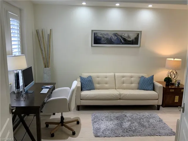 Office area with wood finished floors