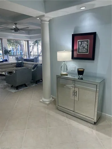 Hall with decorative columns and recessed lighting