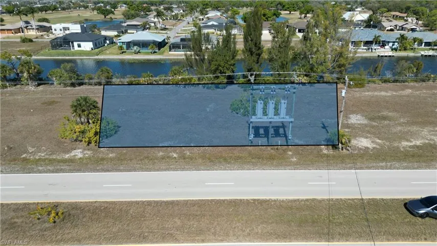 Aerial view of residential area with a nearby body of water