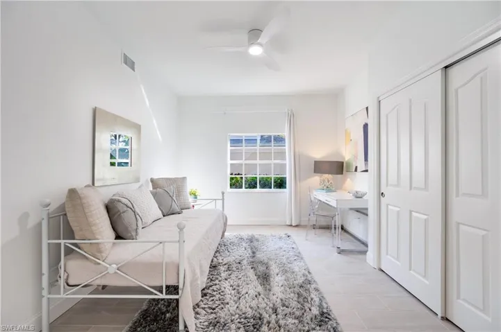 Living area featuring ceiling fan and wood finish floors