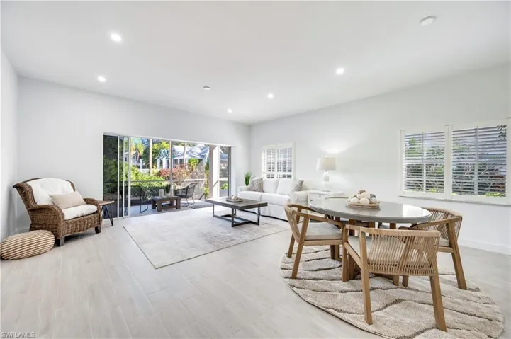 Dining area featuring light wood-style floors and recessed lighting