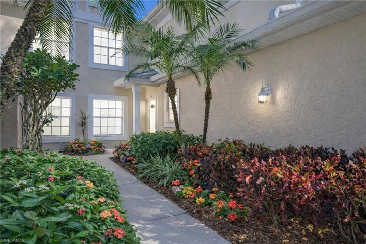 Doorway to property with stucco siding