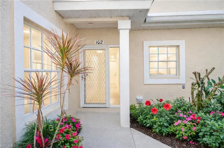 Property entrance with stucco siding