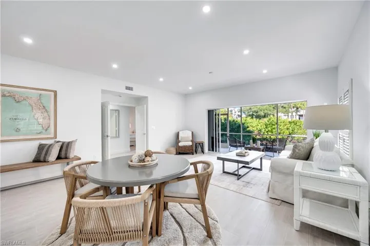 Dining space with recessed lighting and wood finished floors
