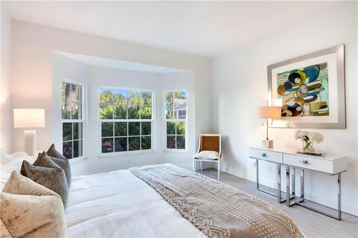 Bedroom featuring baseboards and wood finished floors