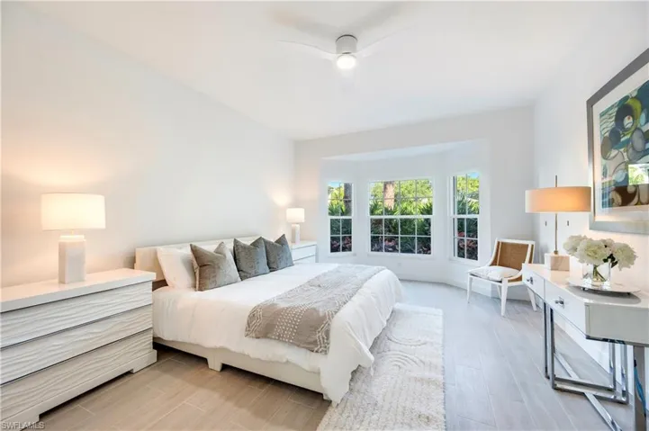Bedroom featuring ceiling fan and wood tiled floors