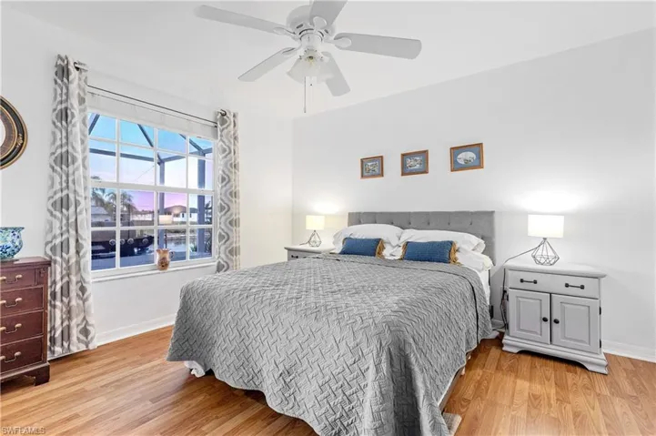 Bedroom featuring light wood-style flooring and a ceiling fan