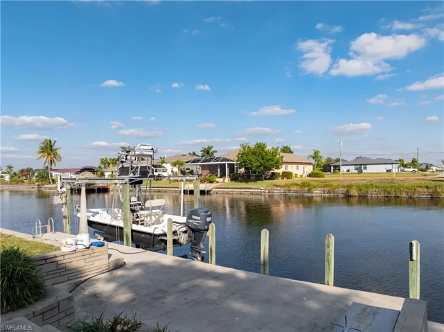 Dock featuring a water view and a residential view