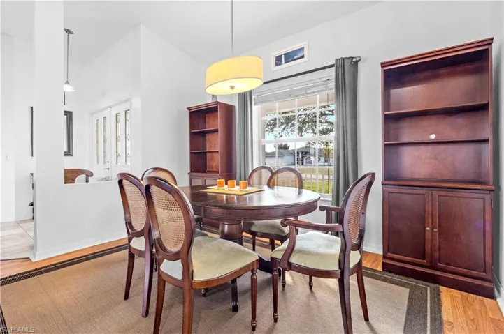 Dining space with light wood finished floors and baseboards