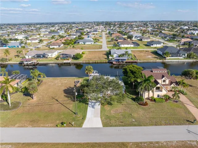 Aerial perspective of suburban area with a large body of water
