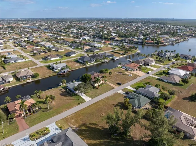 View of property location featuring nearby suburban area and a large body of water