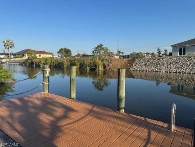 Dock area featuring a water view