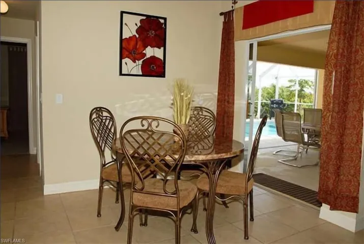 Dining space featuring tile patterned flooring and baseboards