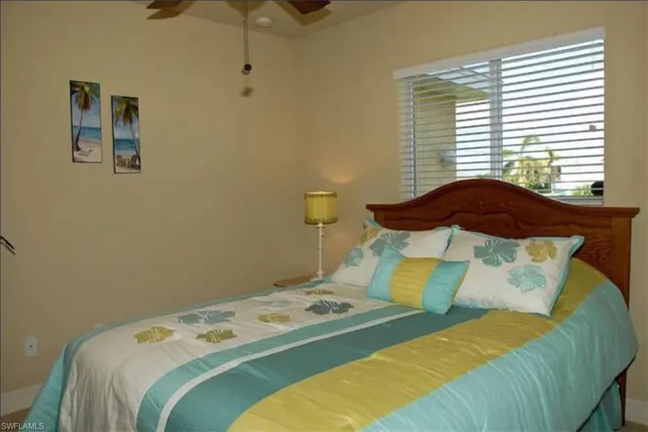 Bedroom with baseboards and ceiling fan