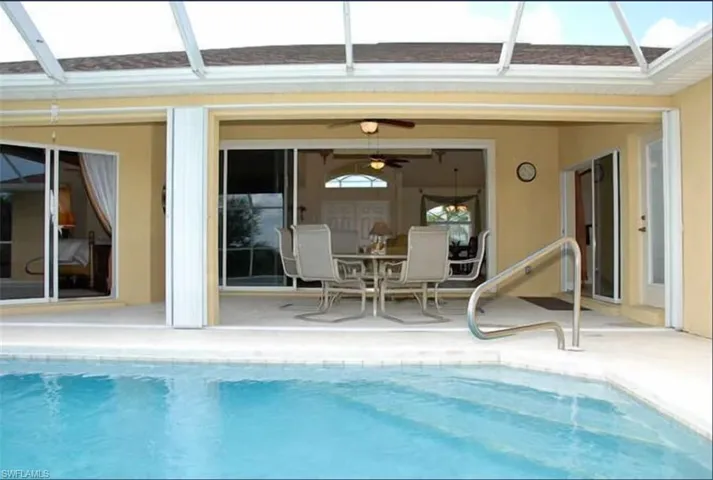 Outdoor pool featuring a lanai and a patio area