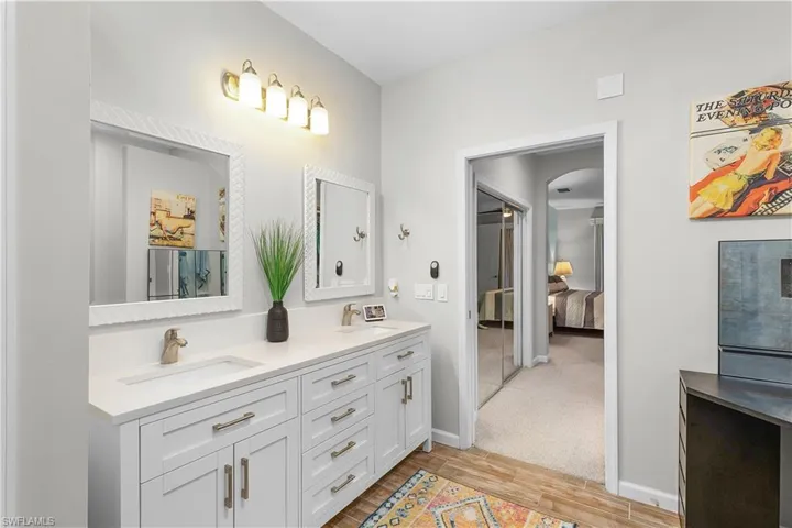 Bathroom with vanity and wood-type flooring
