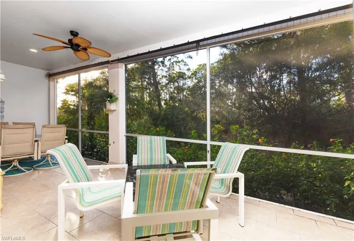 Sunroom / solarium featuring ceiling fan