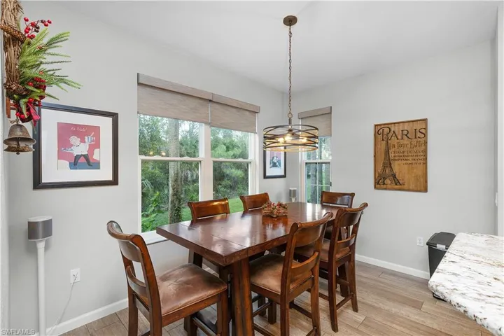 Dining space with light hardwood / wood-style floors