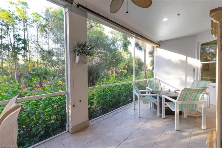 Unfurnished sunroom with ceiling fan