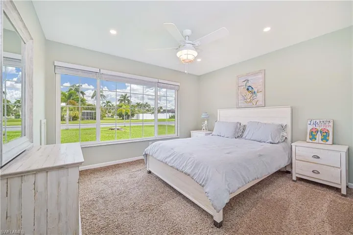 Bedroom featuring carpet floors, access to outside, recessed lighting, and a ceiling fan