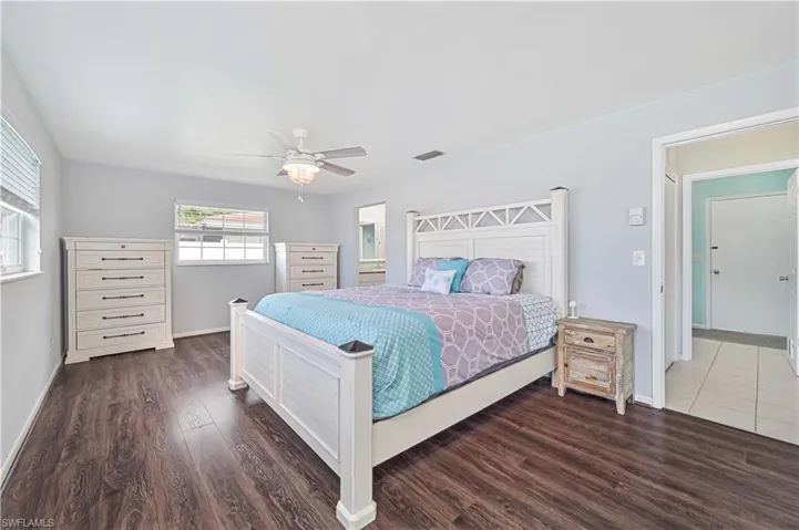 Bedroom featuring wood finished floors and ceiling fan