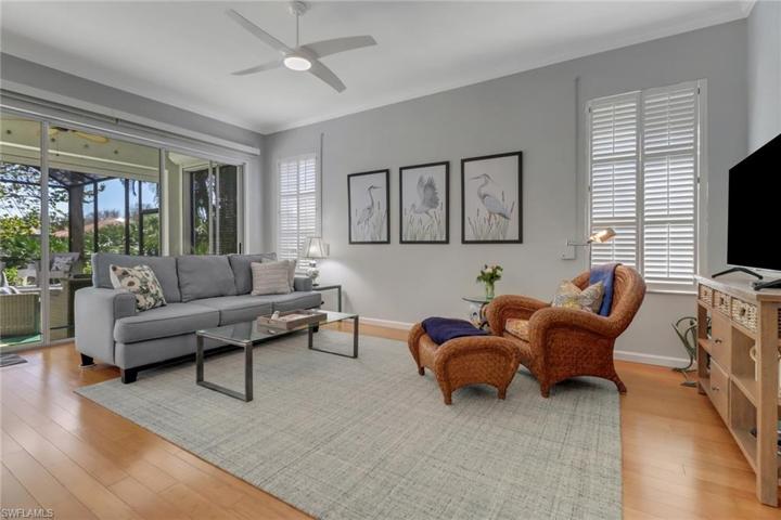 LIVING ROOM OPENING TO PATIO & POOL
