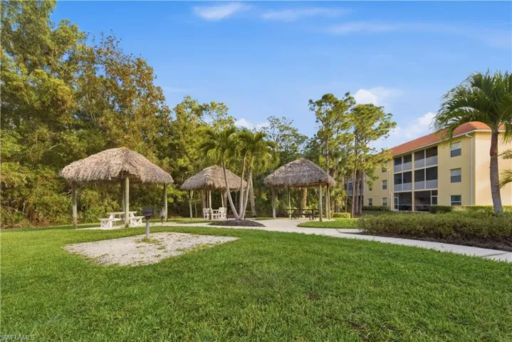 Party fun in the tiki huts and grilling areas with tables
