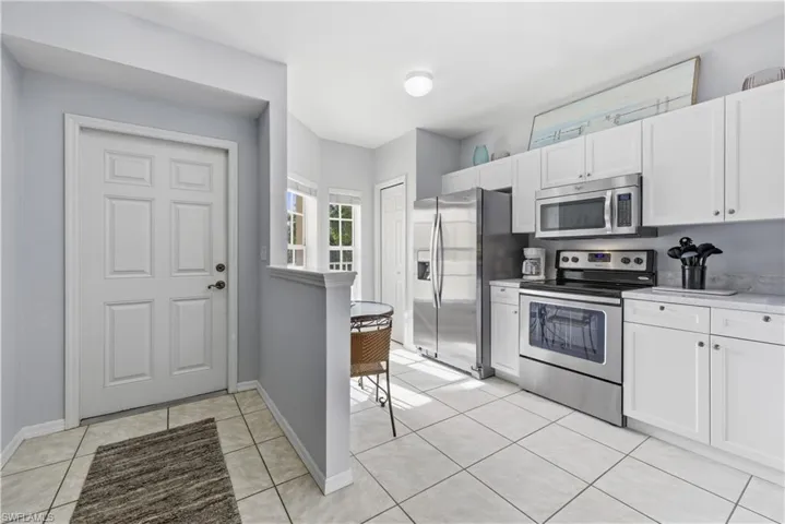 Entry and bright modern coastal kitchen