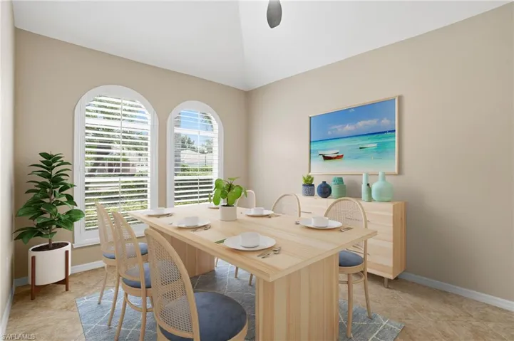 Office with light tile patterned flooring and ceiling fan