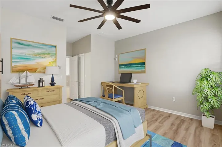 Bedroom featuring wood finished floors and a ceiling fan