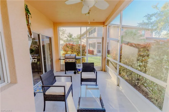 Sunroom featuring a ceiling fan and outdoor lounge area