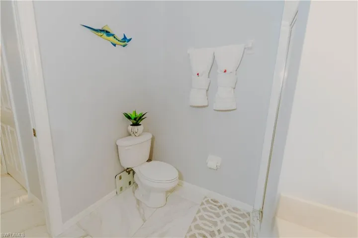 Bathroom with baseboards and toilet