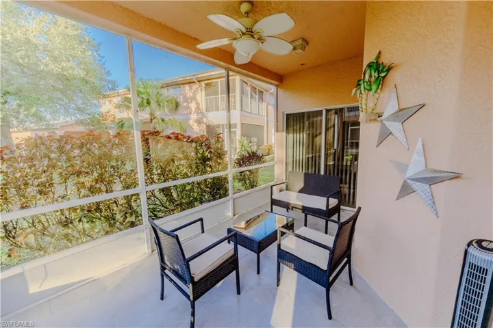 Sunroom / solarium featuring an outdoor living space and ceiling fan