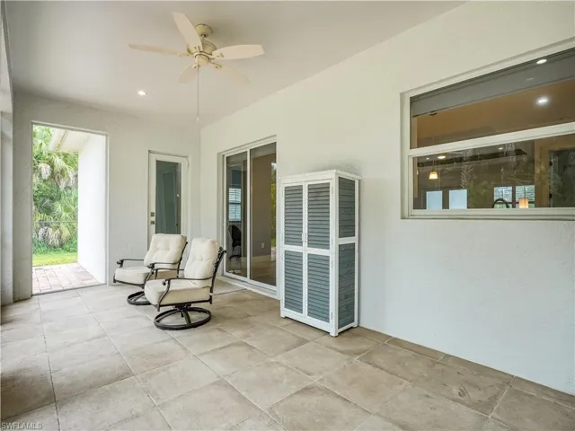 Screened in back Patio with ceiling fan