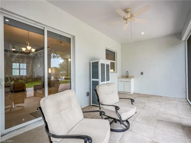 Screened in back Patio with ceiling fan and sink