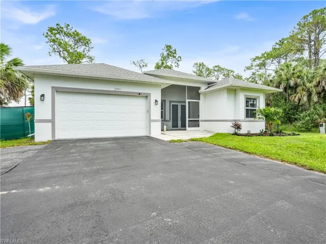 Front of the home with paved driveway