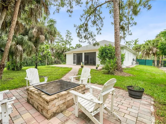 Fenced in Back Yard with Fire Pit and Pavers