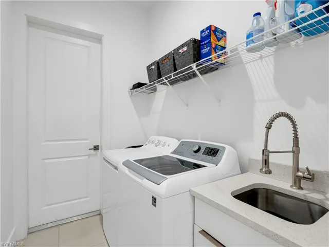 Laundry Room with Washer, Dryer, and Sink