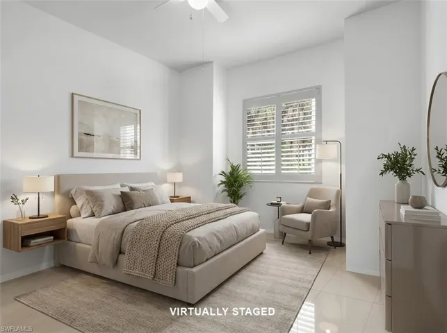 Virtually Staged - Guest Bedroom #1 with large tile flooring and ceiling fan with lighting