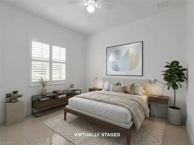 Virtually Staged - Guest Bedroom #3 with large tile flooring and ceiling fan with lighting