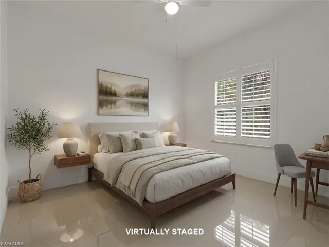 Virtually Staged - Guest Bedroom #2 with large tile flooring, closet and ceiling fan with lighting