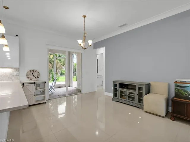 Dining Area with large tile flooring and lighting fixture