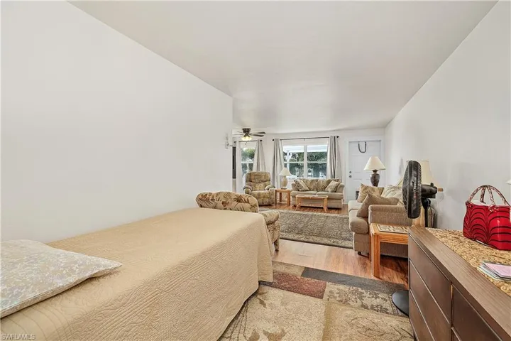 Bedroom with hardwood / wood-style floors
