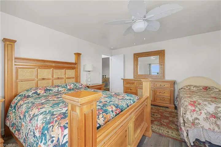 Bedroom with wood-type flooring and ceiling fan