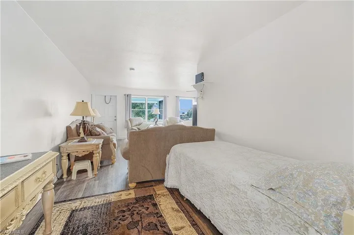 Bedroom with wood-type flooring
