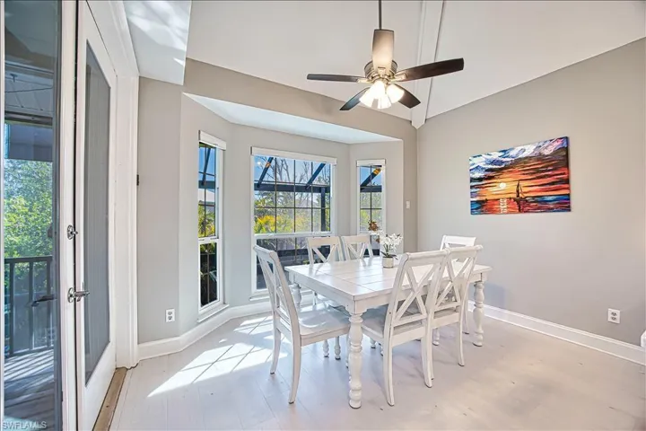 Dining space featuring ceiling fan and light hardwood / wood-style flooring