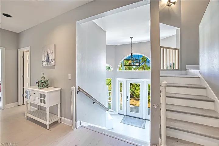 Foyer with light hardwood / wood-style flooring