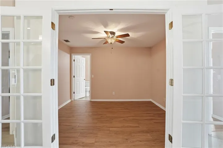 French doors leading to the den, also with access to guest bathroom.