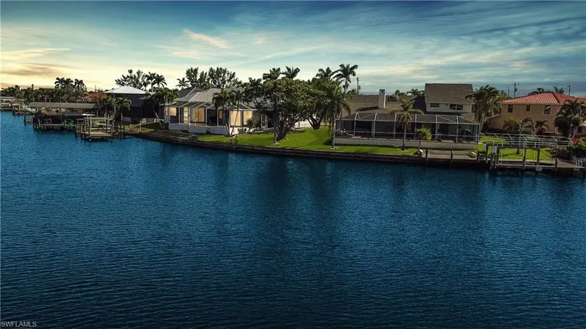 View of water feature with a dock