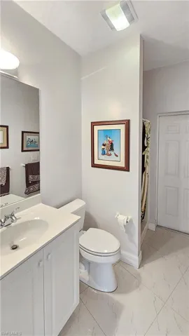 Bathroom with vanity and toilet